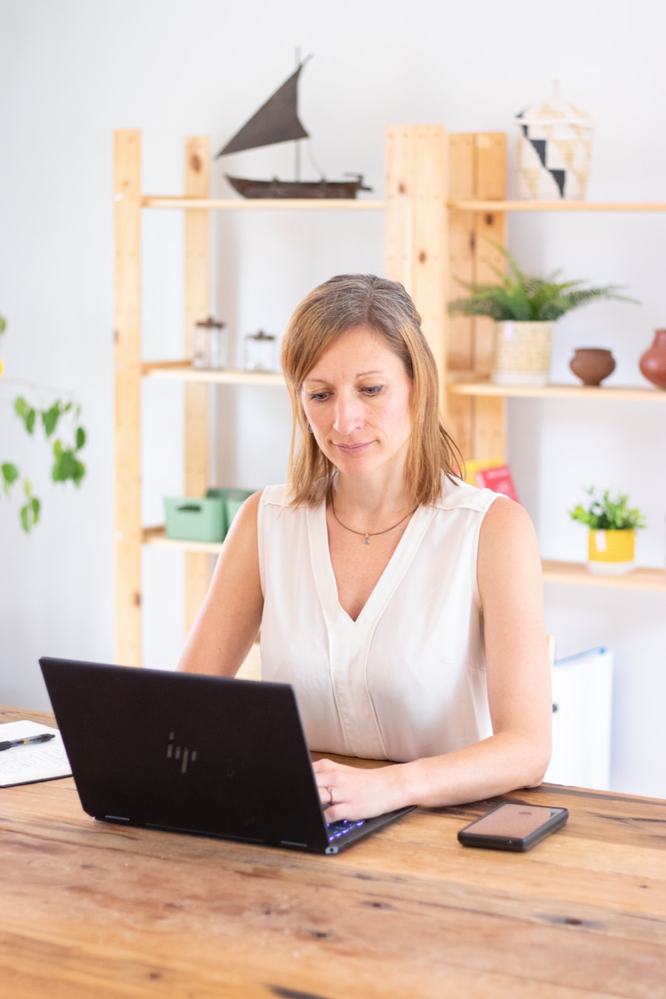 Erica Layer working at her desk